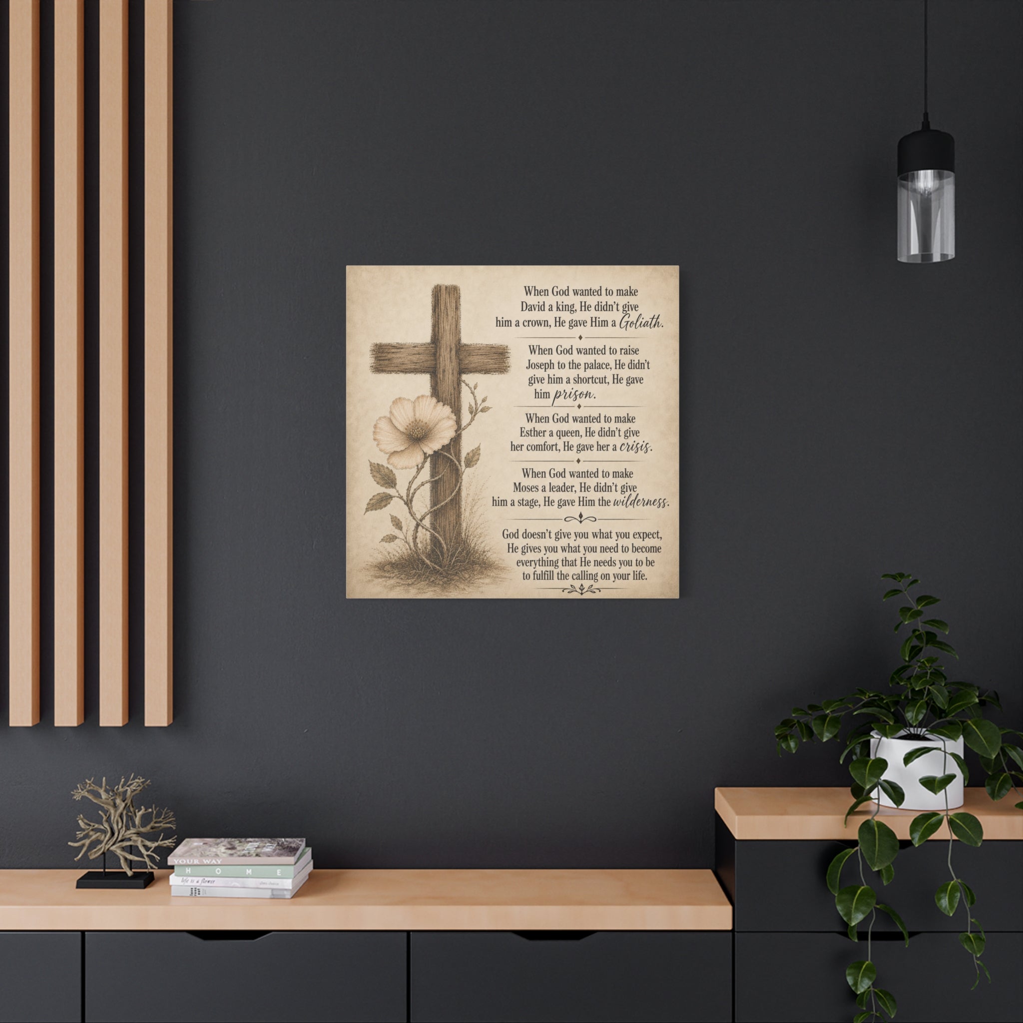 Decorative wall art with cross and flower on a dark wall with wooden shelves.